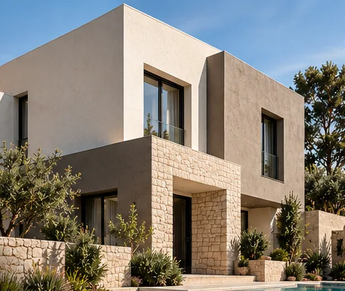 Villa beige à grain fin, soubassement en pierre et bassin